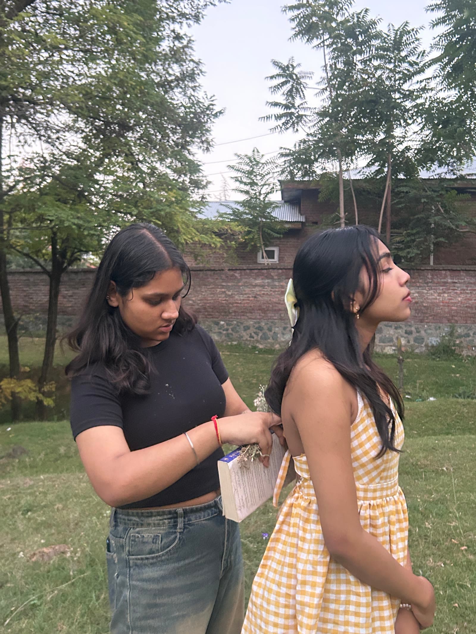Behind-the-scenes fitting work on the yellow gingham dress